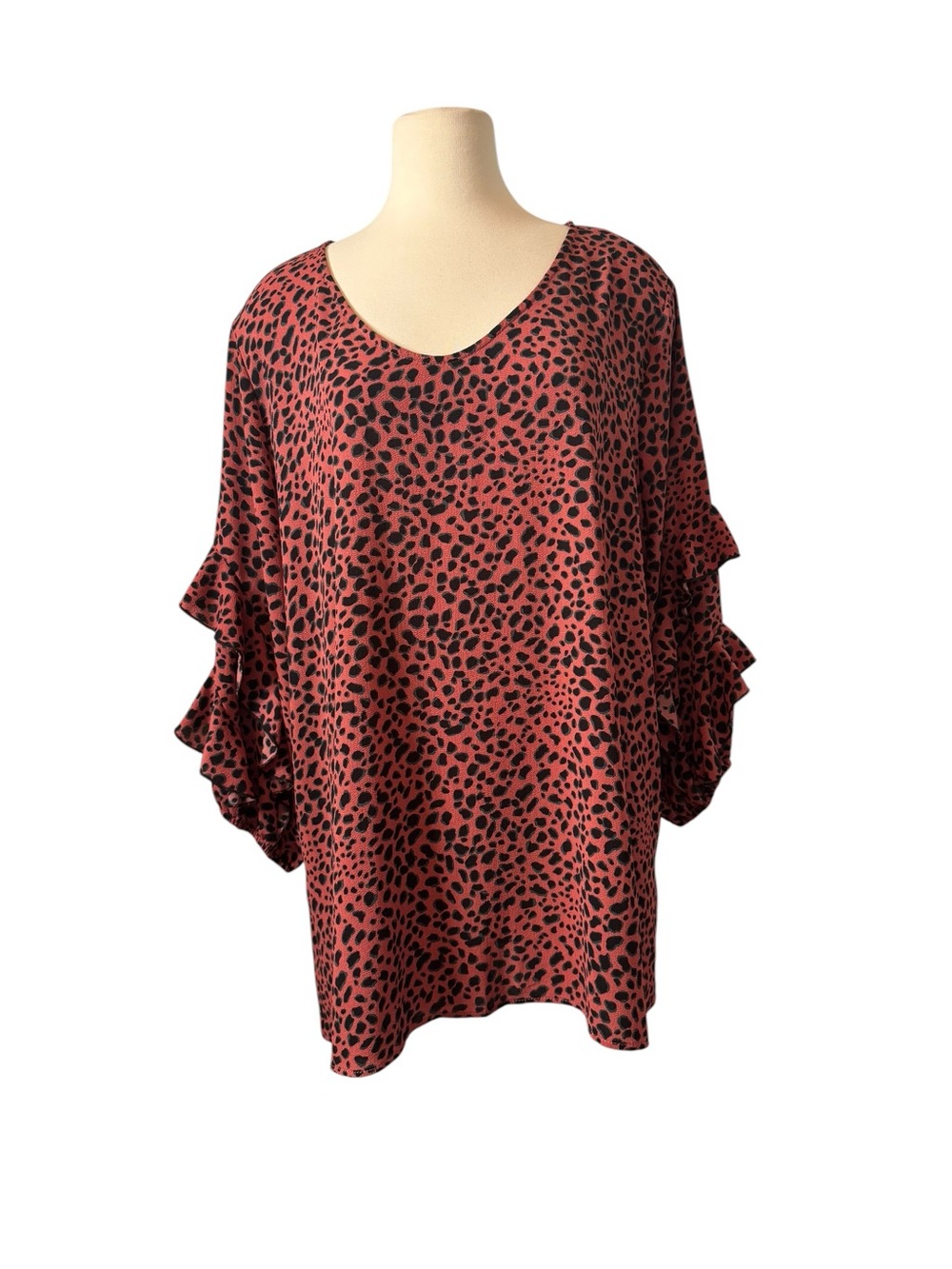 ODDY Rust Animal Print Ruffle Sleeve with black and teal accents.